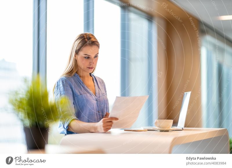 Portrait of confident businesswoman in office girl people Entrepreneur successful professional young adult female lifestyle indoors millennial attractive