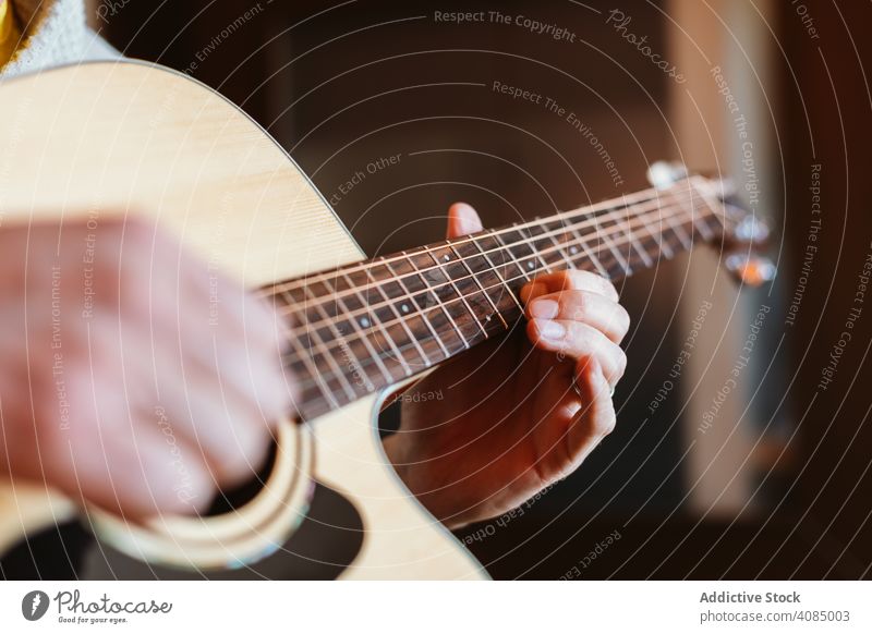 Detail of a man playing the guitar musician acoustic closeup instrument old detail hand player musical string concert chord classic guitarist electric finger