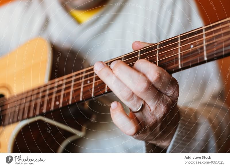 Detail of a man playing the guitar musician acoustic closeup instrument old detail hand player musical string concert chord classic guitarist electric finger