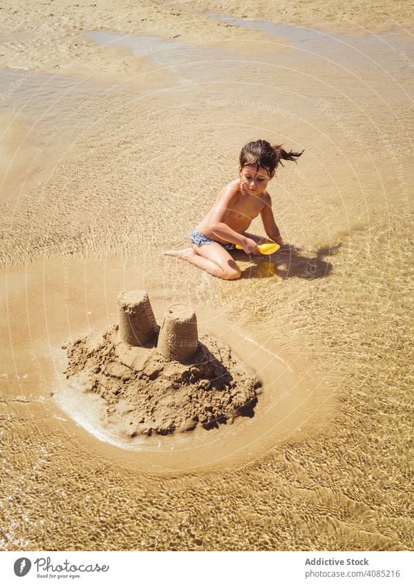 little girl building a sand castle beach sandcastle child summer cute children toys kid tropical happy water vacation ocean maldives play playing holiday kids