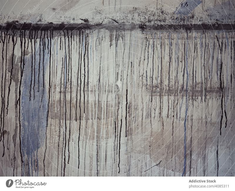 Grungy concrete wall in workshop grungy spills paint artist surface rough weathered mess dirty cement gray construction structure studio old aged distressed