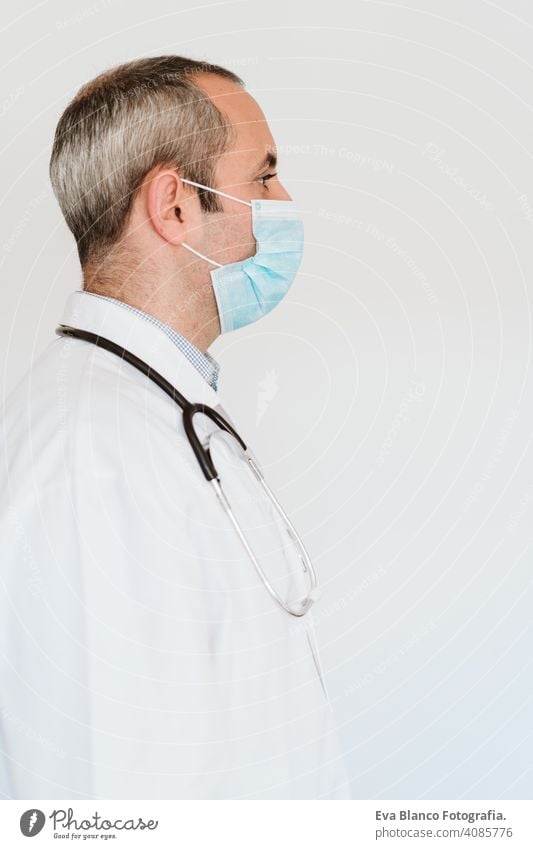 portrait of doctor wearing protective mask and gloves indoors. Corona virus concept man professional corona virus hospital working infection safety epidemic