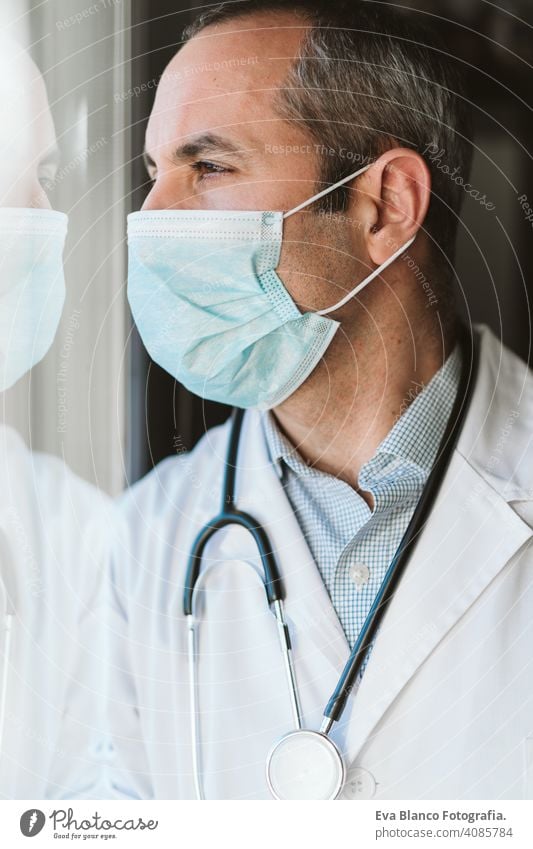 doctor man wearing protective mask and gloves indoors. Corona virus concept portrait professional corona virus hospital working infection safety epidemic