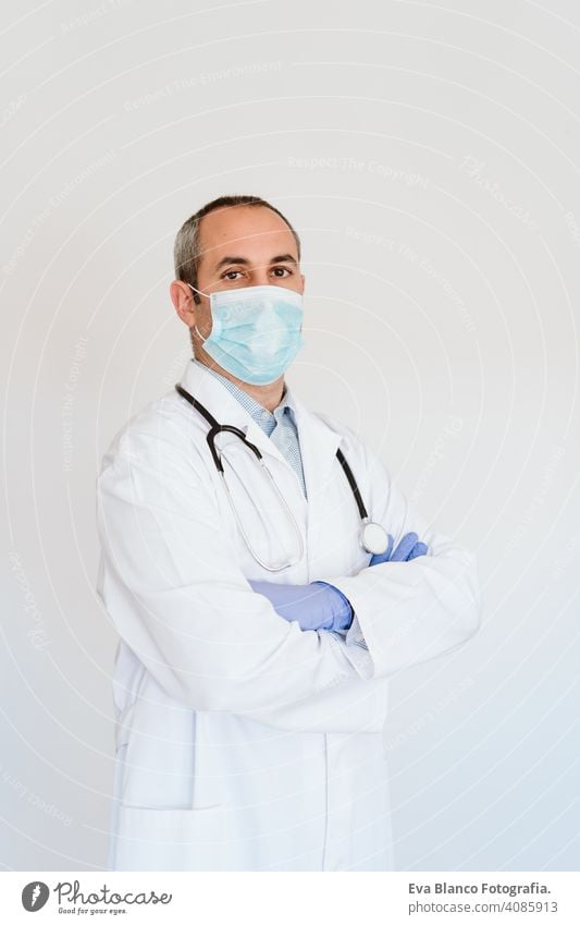 portrait of caucasian doctor using protective gloves and mask. Chinese Corona virus concept. 2019-nCoV man professional corona virus hospital working infection