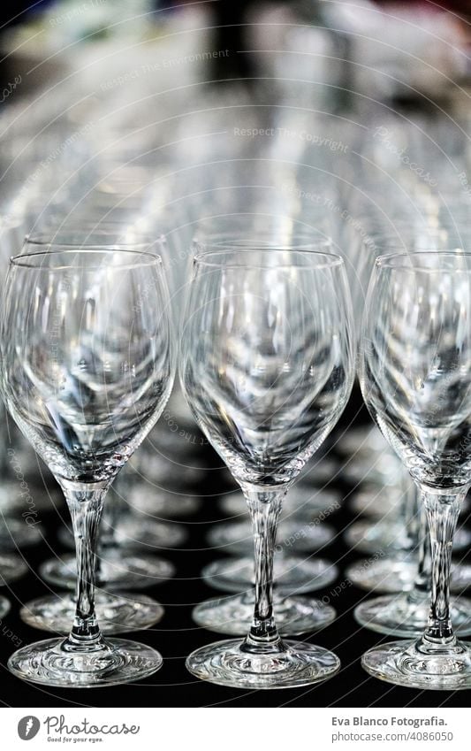 Wine Glass at the exhibition on the table. wedding decor repetition restaurant glass toast celebration alcohol empty drink wineglass row pattern people nobody