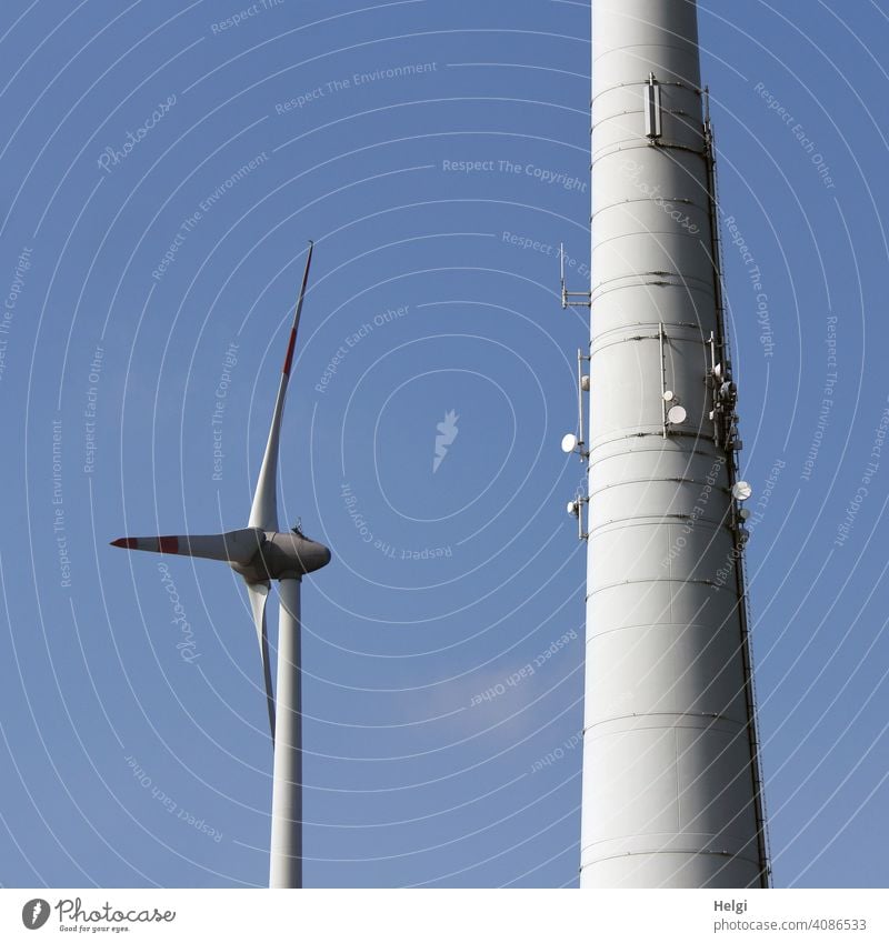 Wind turbines - one smaller and one huge one with several satellite dishes attached to the mast Pinwheel Wind energy plant stream power supply Energy