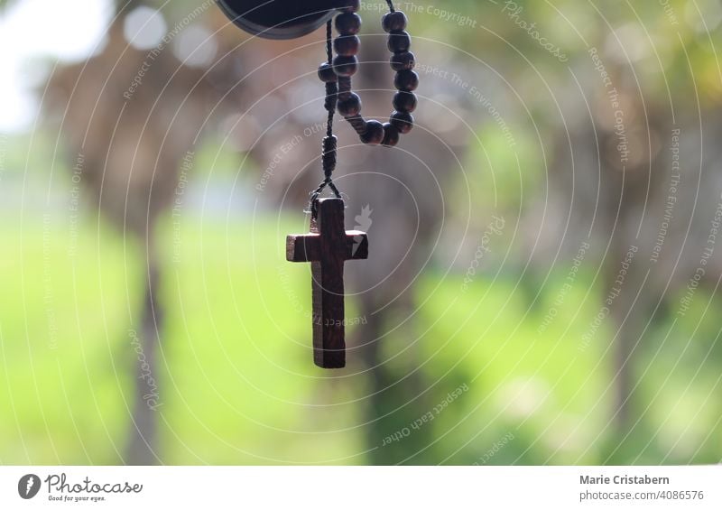 Wooden rosary cross symbolizing Christianity and the Lenten Season religious celebration spiritual concept christian rosary beads love worship jesus christ