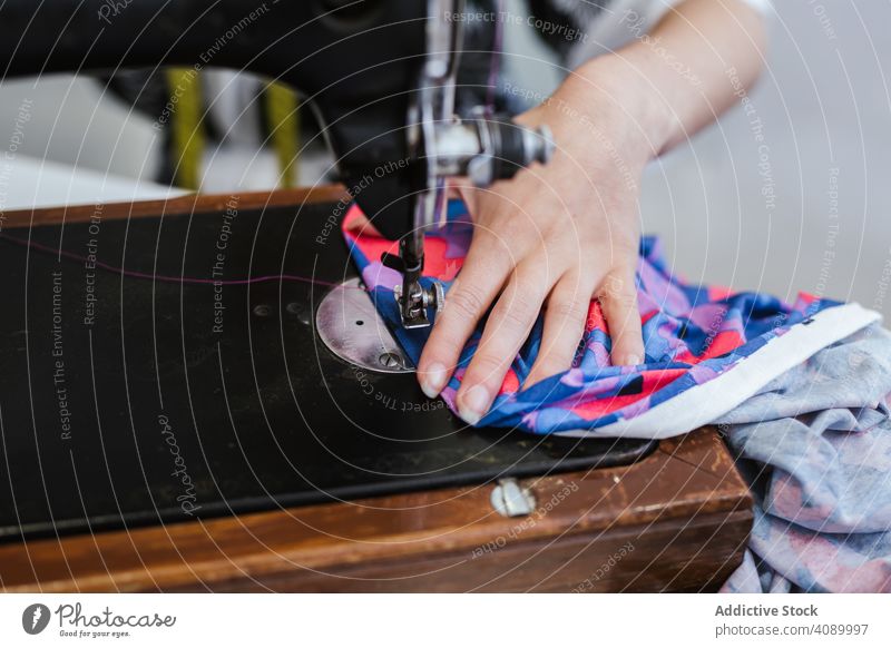 Teenage girl in a sewing school woman class classroom teenager clothing embroidery fabric factory job machine pattern profession seamstress student studio