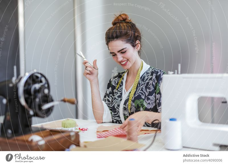 Teenage girl in a sewing school woman class classroom teenager clothing embroidery fabric factory job machine pattern profession seamstress student studio