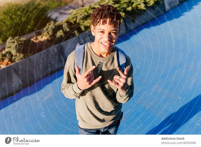 Young African American man showing shaka hand sign happy shaka sign black smiling city hipster young african american male ethnic joy cheerful handsome