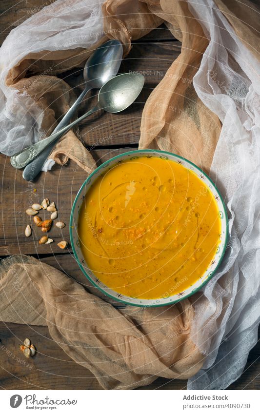 Bowl with pumpkin puree bowl spoons napkins seeds table wooden food vegetable healthy vegetarian vegan dinner diet meal mashed dish fresh soup Sweet potato