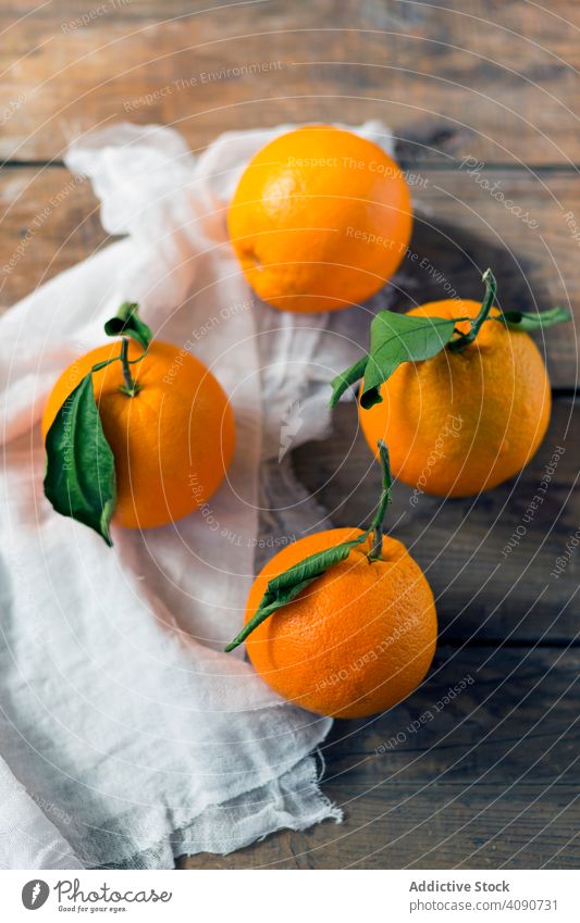 https://www.photocase.com/photos/4090731-fresh-oranges-on-table-fresh-napkin-food-natural-photocase-stock-photo-large.jpeg