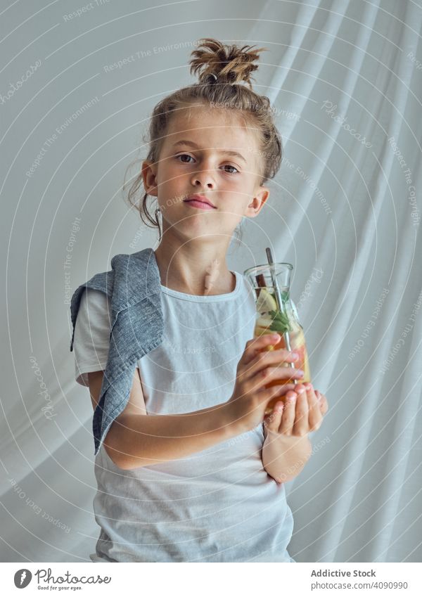 Boy holding glass bottle with lemonade boy drink child childhood beautiful people handsome lifestyle health happy attractive refreshment beverage cocktail fruit