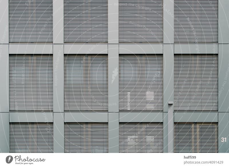 Modern exterior facade with closed blinds Venetian blinds Disk Slat blinds Window Contrast Modern architecture Closed Architecture Facade Roller shutter