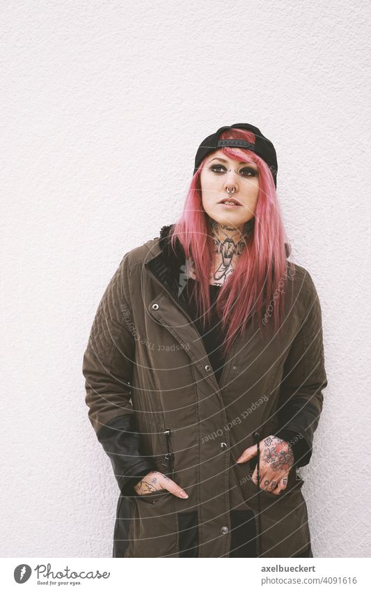 young woman with pink hair, piercings and tattoos Young woman Piercing Tattoo E-Girl Hipster real people Subculture pierced Tattooed Alternative Parka Emo