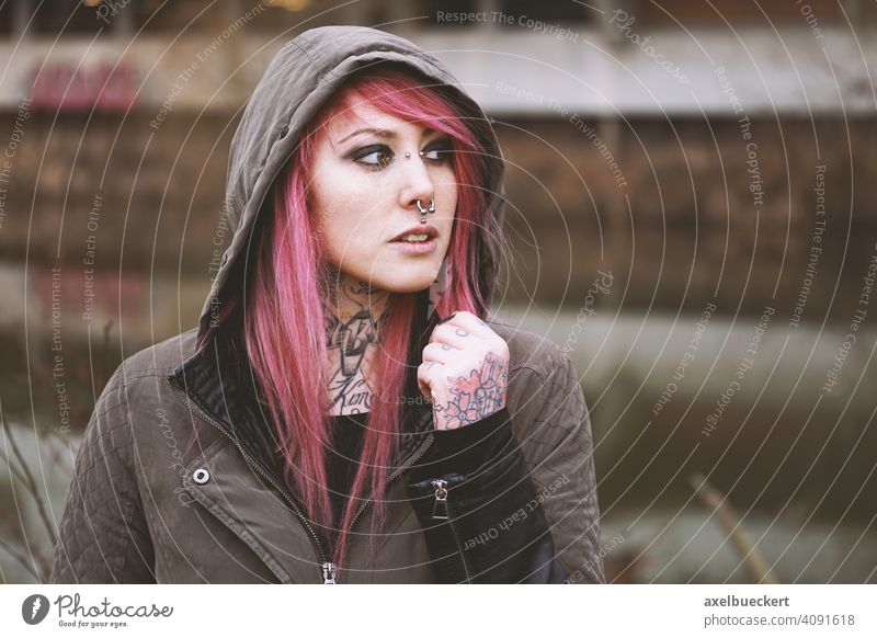 young woman with pink hair, piercings and tattoos real people Young woman Piercing Tattoo E-Girl Hipster Subculture pierced Tattooed Alternative Parka Emo