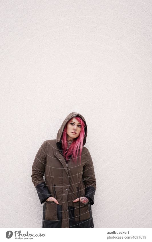 young woman with pink hair, piercings and tattoos Young woman Piercing Tattoo E-Girl Hipster real people Subculture pierced Tattooed Alternative Parka Emo