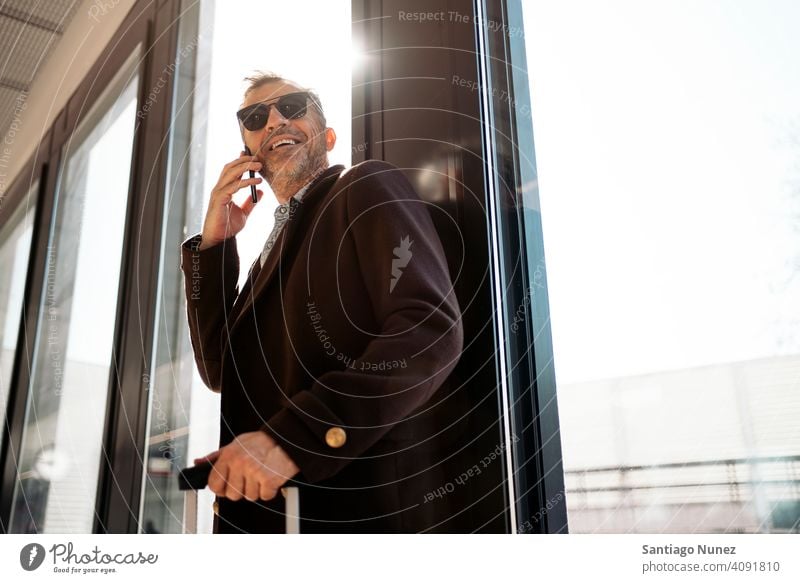 Casual business man on the phone. person lifestyle people middle aged handsome senior caucasian city adult male portrait casual urban confident fashion