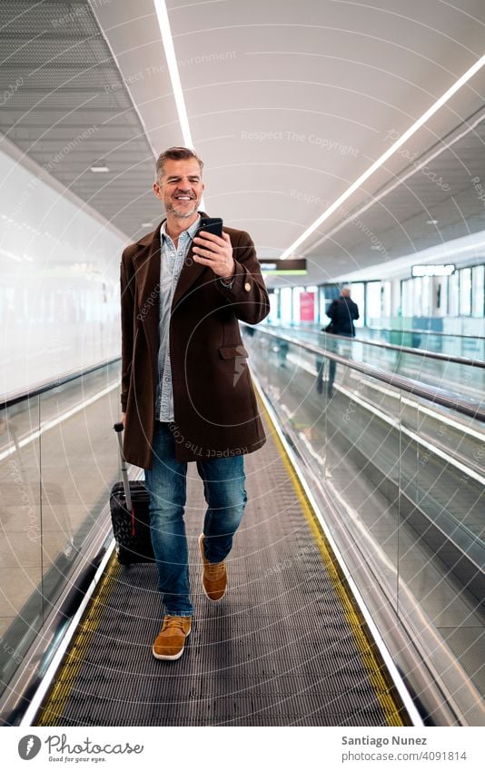 Caucasian business man at airport. person lifestyle people middle aged handsome senior caucasian city adult male portrait casual confident fashion grey hair