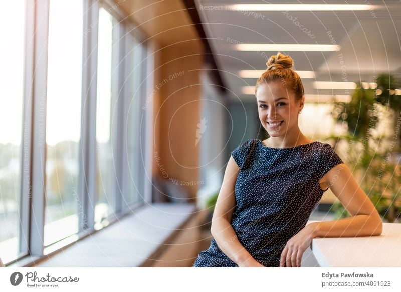 Smiling woman in the office girl people Entrepreneur business businesswoman successful professional young adult female lifestyle indoors millennial attractive