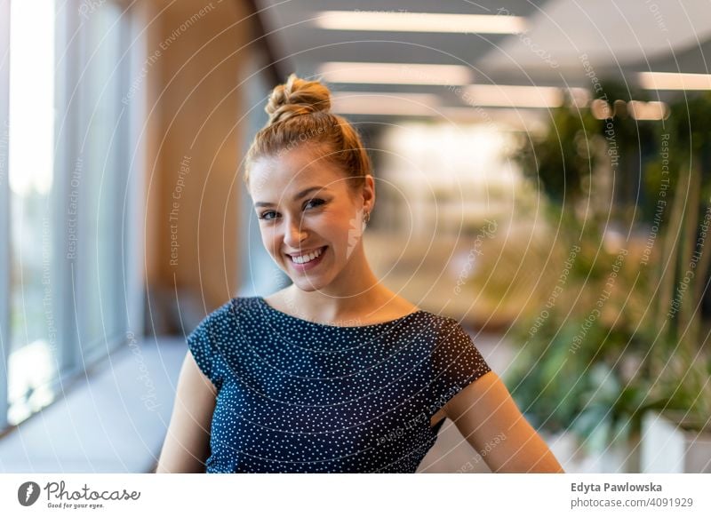 Smiling woman in the office girl people Entrepreneur business businesswoman successful professional young adult female lifestyle indoors millennial attractive