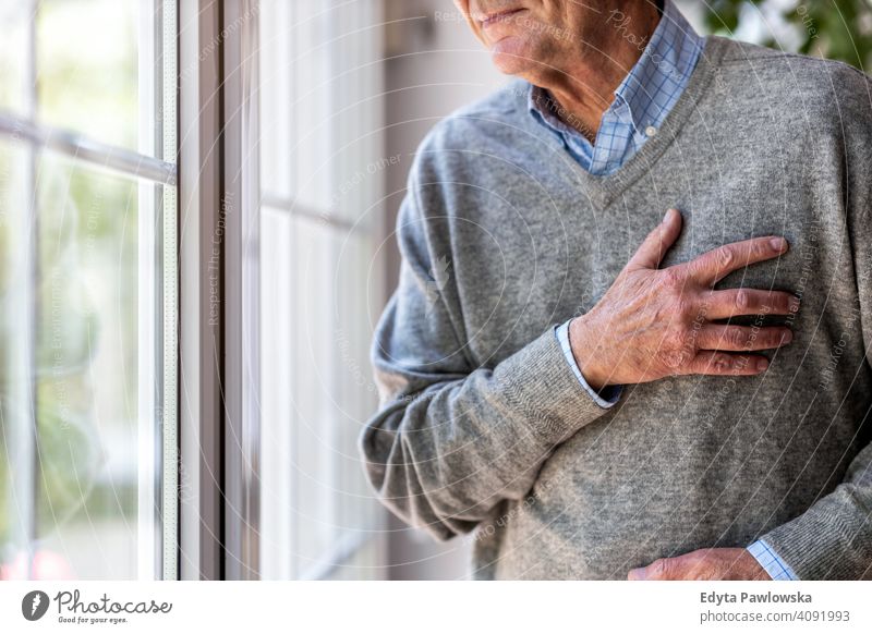 Senior man Suffering From Chest Pain chest pain heart attack cardiac arrest high blood pressure stress illness sick suffering senior elderly grandfather old