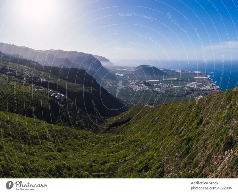 Picturesque view of town on coast with mountains valley drone view picturesque spain tenerife landscape nature travel aerial remote tourism blue sky trip