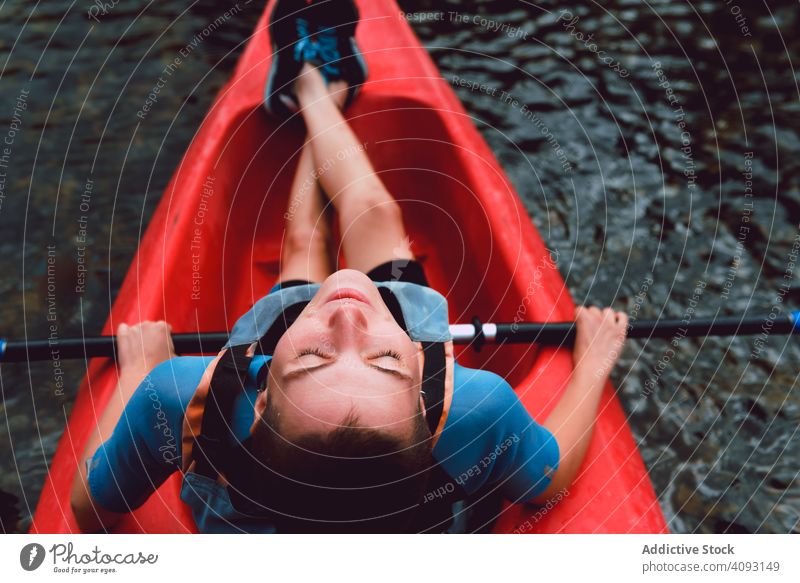 Female kayaking with paddle in raised hands woman sport sella river spain water canoe activity tourism adventure lifestyle travel female joyful athletic fit