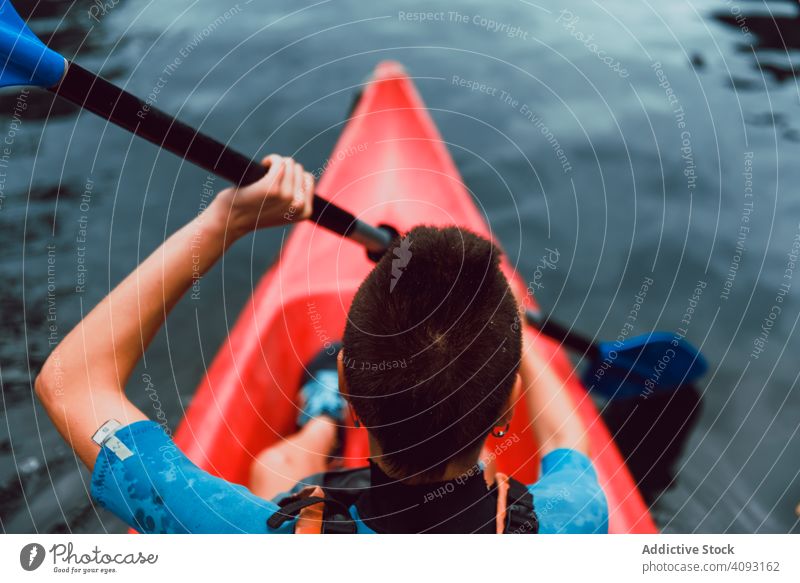 Female kayaking with paddle in raised hands woman winner competition sport sella river spain water canoe activity tourism adventure lifestyle travel female
