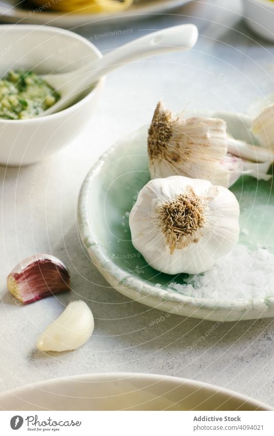 Fresh garlic and ingredients for Italian dish italian plate clove cheese oil pesto rustic traditional delicious cuisine meal healthy tasty kitchen gourmet food