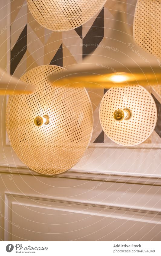 Stylish illumination lamps fixed to wall stylish modern room geometric shape architecture unusual warm light emit inside round design estate interior style