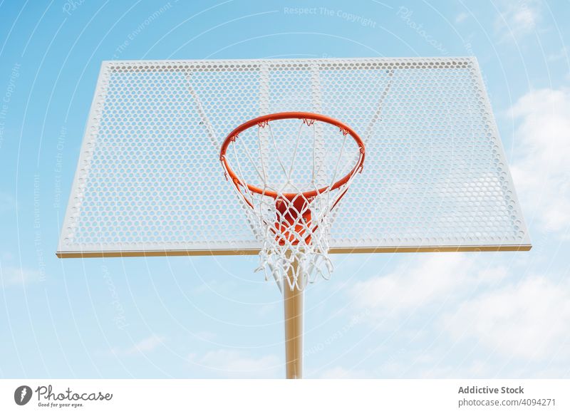 Outdoor basketball court from below man athlete competition sports equipment adult recreation action portrait active activity asphalt athletic city drop drops