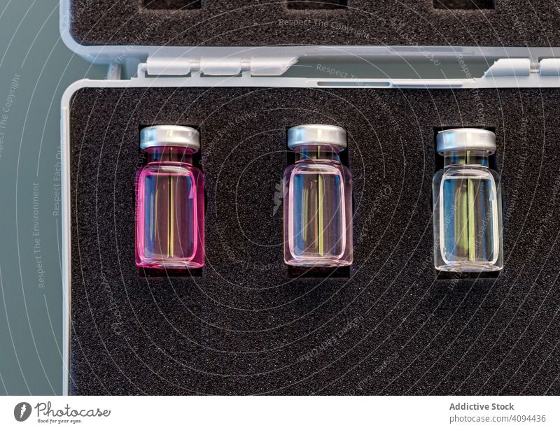Medical vials arranged in carrying case chemical sample medical scientific liquid tube ampoule fluid laboratory research glass soft solution foam rubber