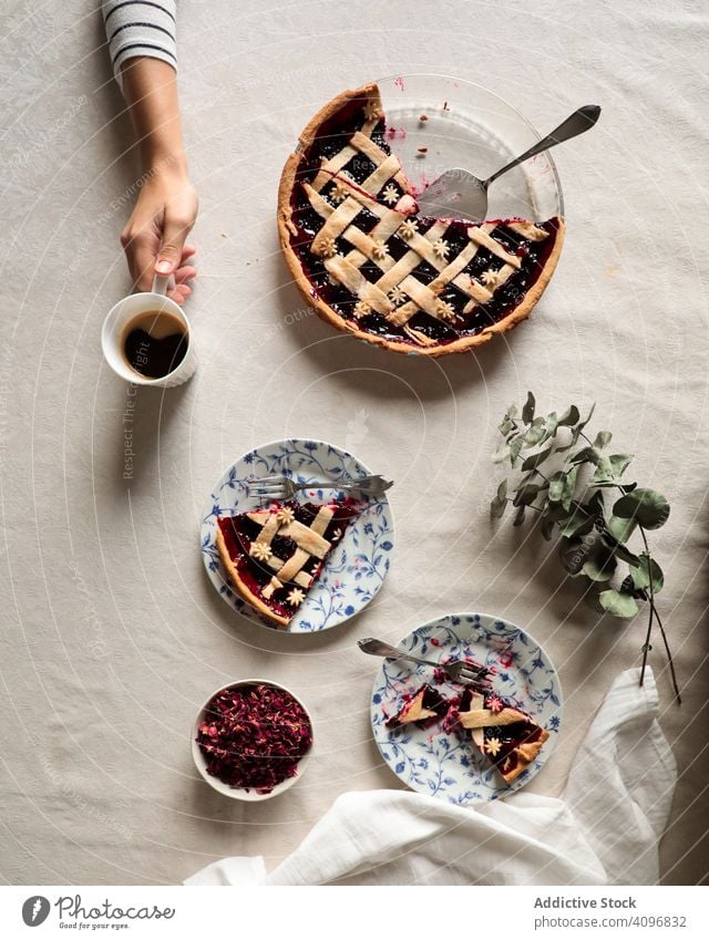 Faceless person enjoying coffee with homemade pie delicious berry cake baked served eat drink prepared cooked sweet tasty fresh yummy filling fruit food pastry