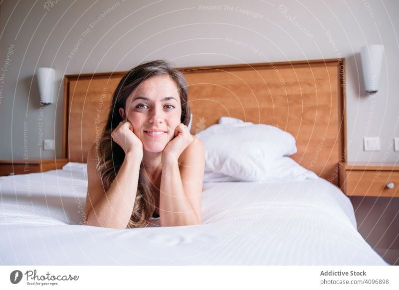 Girl in a bed lit with window light in the morning pretty awake joy girl beauty indoors view home lying down sleep rest lifestyle beautiful waking young