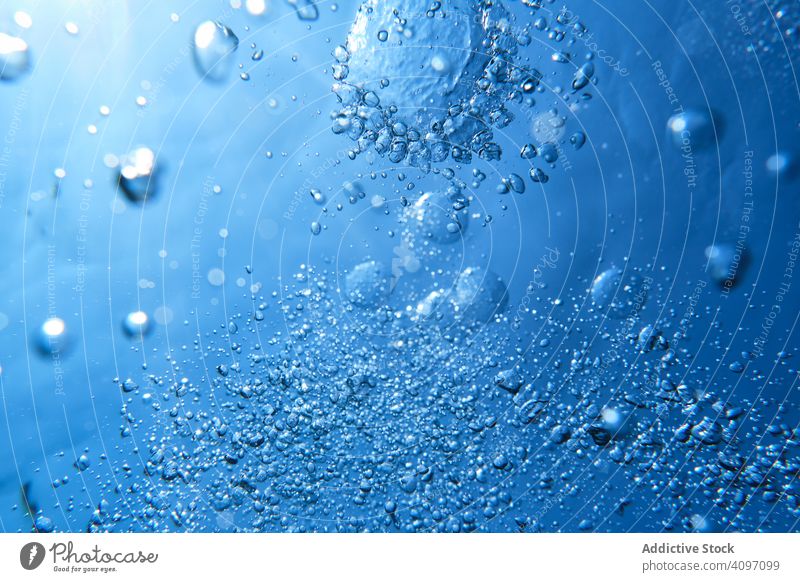 Popping up air bubbles in sea water background clear underwater clean oxygen purity breathe smooth motion fresh surface ocean transparent drop submerged dive