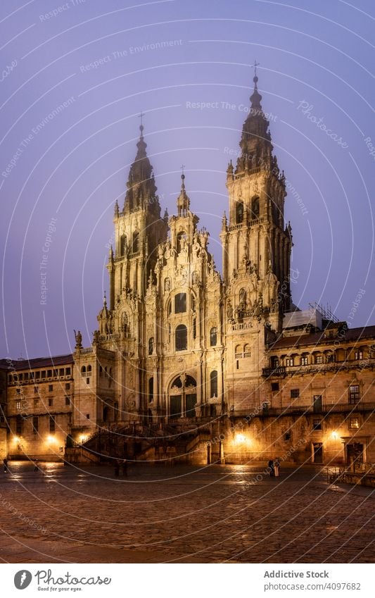 Santiago de Compostela Cathedral view at misty foggy night after rain. Cathedral of Saint James pilgrimage. Galicia, Spain ancient architecture baroque building