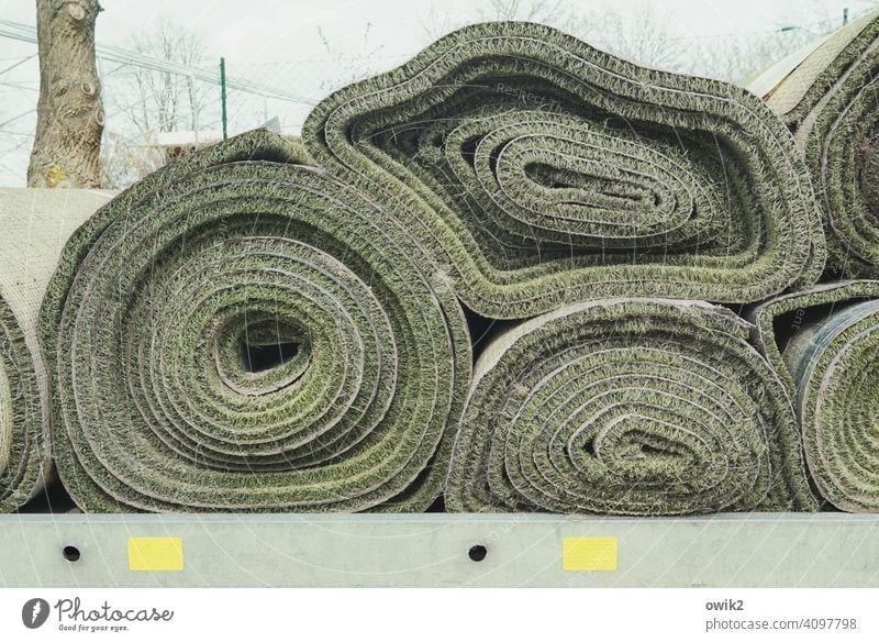 rest gently Carpet shape deformed Gravity Heavy Lie Stack Structures and shapes Exterior shot Deserted Colour photo Pattern Detail Round Carpet rolls Close-up