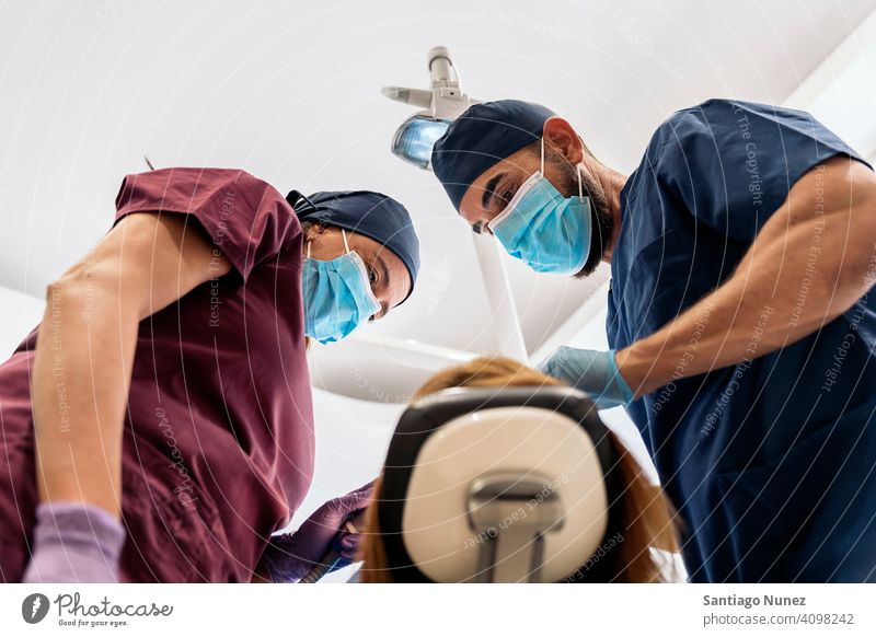 Dental Clinic Workers Bottom View man woman patient standing looking examining bottom view dentist clinic dental clinic lying health care equipment medicine