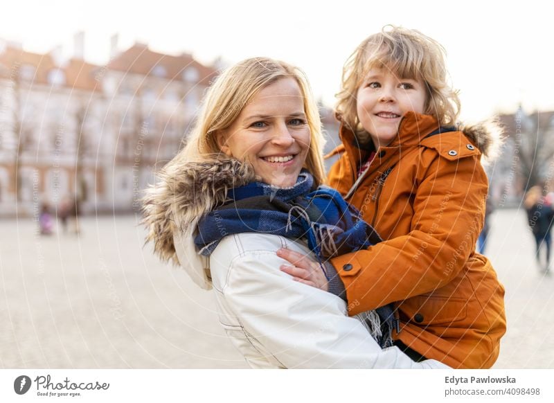 Mother and cute little son hugging outdoors young winter woman autumn mother family parents relatives boy kid children relationship together togetherness love