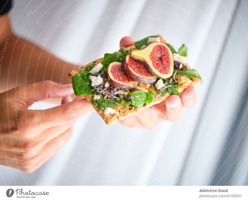 Tasty sandwich with figs and cheese rye bread fresh fruit food meal crisp bread vegetable rocket salad refreshment aromatic breakfast slice healthy exotic herb
