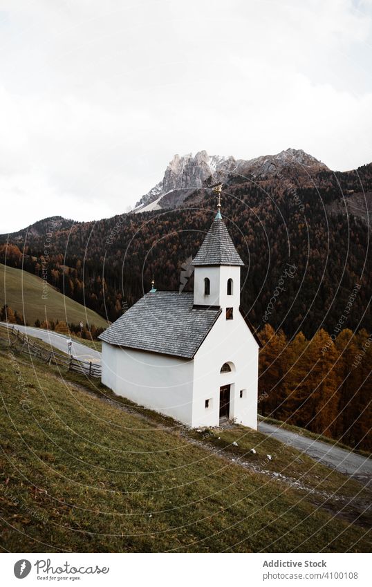 Small church on cliff near forest and mountains travel autumn sky rural countryside tourism architecture landscape landmark nature rock monastery hill holiday
