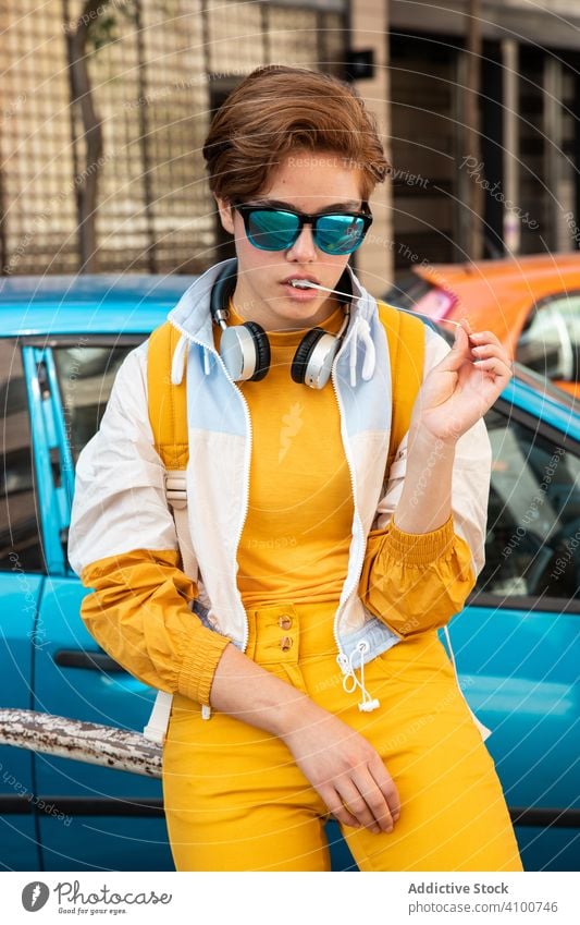 Cool modern woman in vibrant clothes on street colorful millennial urban confident bright rebel gum yellow independent sunglasses individuality cool vivid