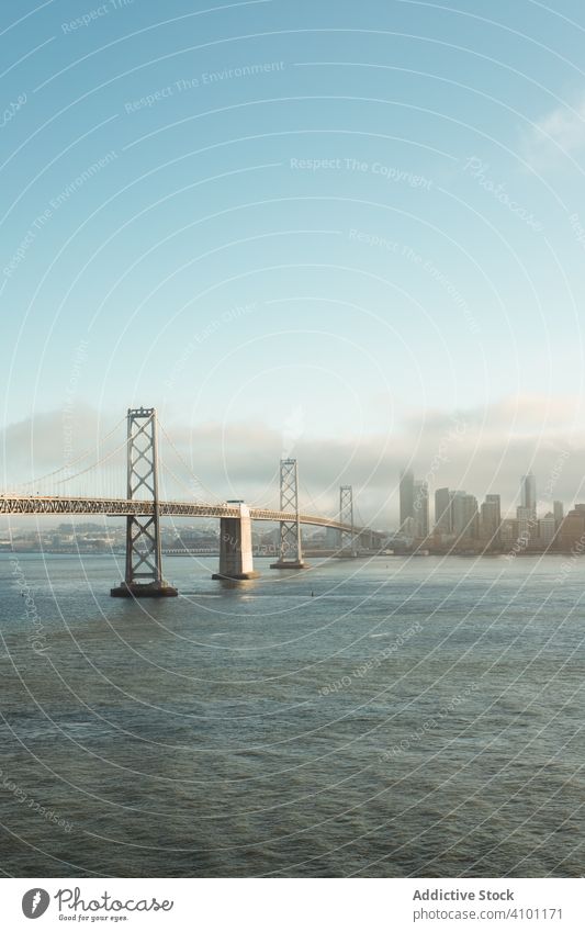 Long bridge construction over wavy water to city downtown architecture structure landscape sea mountain ocean travel island nature san francisco golden gate sky
