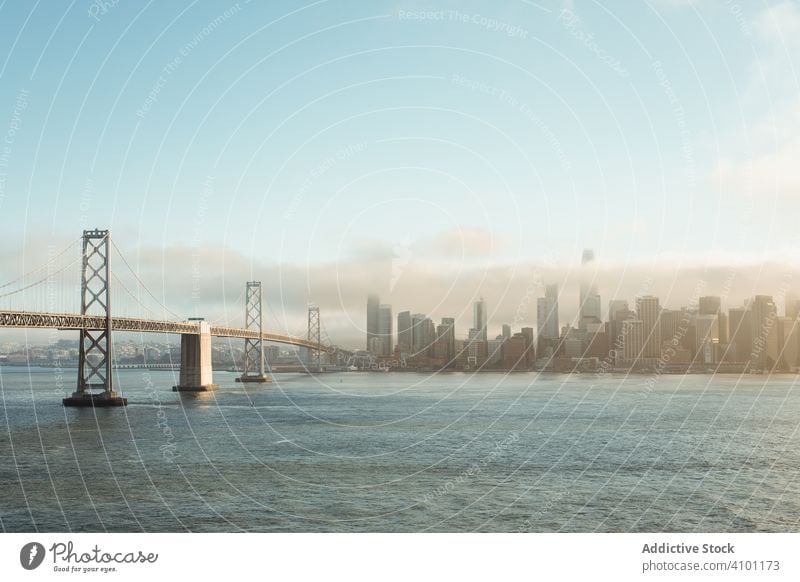 Long bridge construction over wavy water to city downtown architecture structure landscape sea mountain ocean travel island nature san francisco golden gate sky