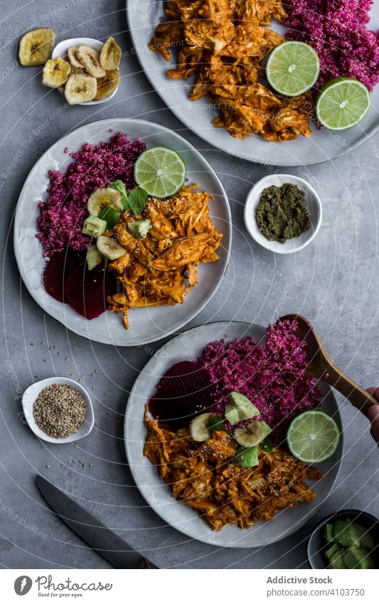 Plates with red quinoa and chicken curry healthy food plate natural meal organic cuisine delicious recipe dish portion dinner diet lunch spicy colorful meat