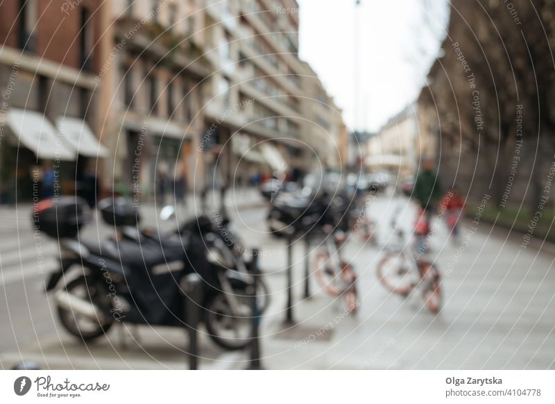 Blurred street with motorbikes. retro scooter motorcycle traditional typical urban building europe perspective blur blurred black city town Milan italian moped