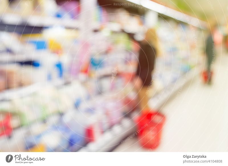 Blurred people in supermarket. food shopping background woman blur product blurred inside interior retail store customer shelf depth distribution merchandise