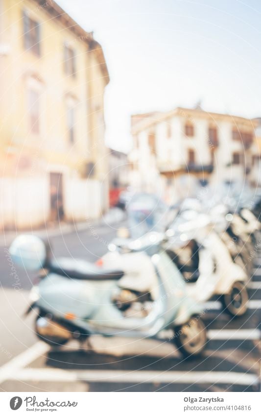 Blurred Italian street with scooters. summer sun italy bike city blur moped background retro vintage urban italian old style motor motorbike motorcycle