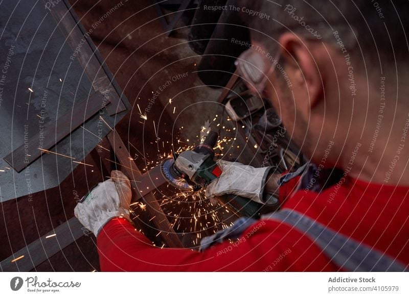 Blacksmith cutting metal blacksmith protection safety gloves disc workshop job mature molten occupation craftsmanship manufacturing industry steel hand iron